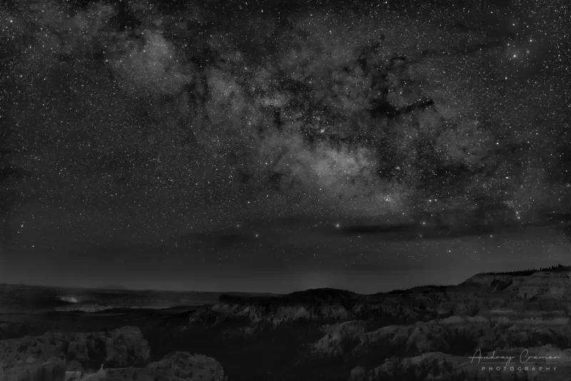 Audrey Cramer Photography's fine art landscape photograph of the Milky Way rising over Bryce Canyon National Park Utah in monochrome or black and white