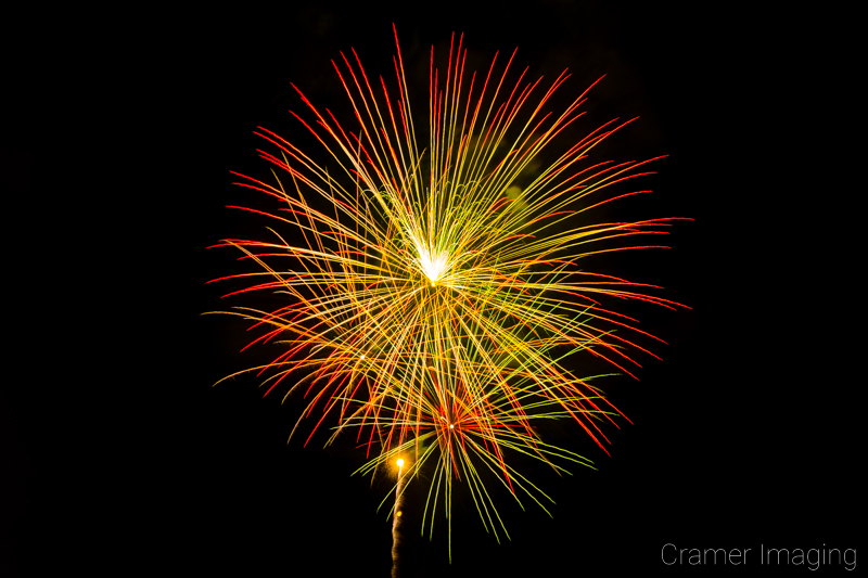 Audrey Cramer Photography's fine art photograph of warm colored fireworks