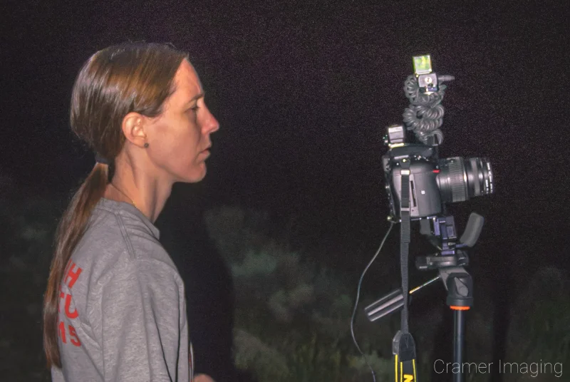 BTS photo of landscape photographer Audrey Cramer shooting a night photo