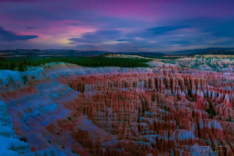 Cramer Imaging's fine art landscape photograph of an Aurora Borealis or Northern Lights appearing in the night sky above Bryce Canyon National Park, Utah