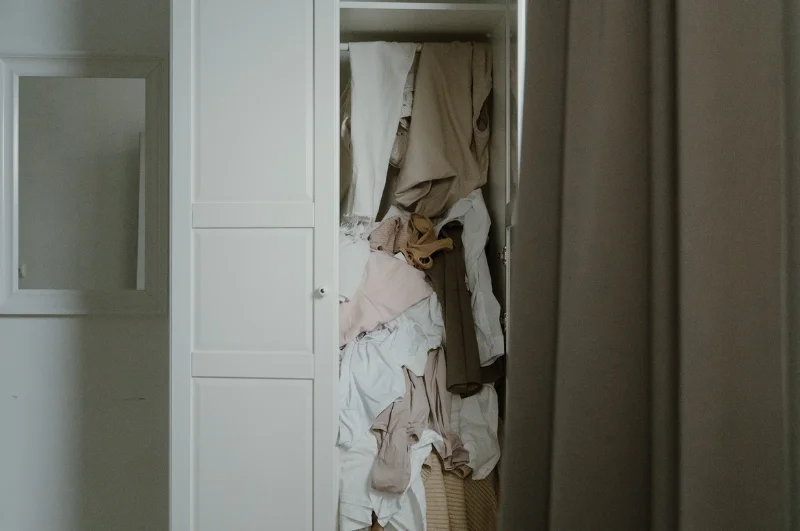 Photo of a disorganized and piled-up closet