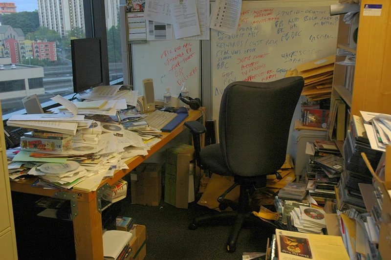 Photo of a messy and piled up office in a highrise building