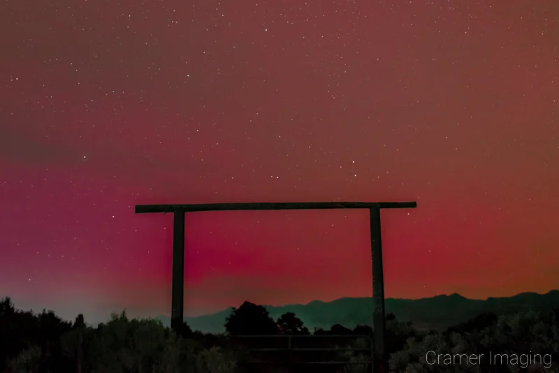 Audrey Cramer Photography's fine art landscape photograph of a red aurora and stars over Panguitch, Utah