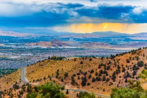 Cramer Imaging's fine art landscape photograph of a moody storm over Reno, Nevada and a mountain road