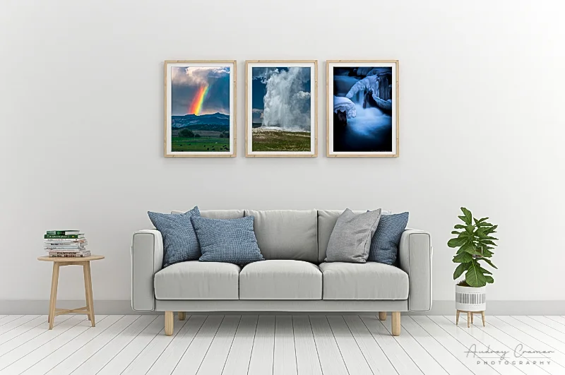 Photo of three cool-tone Cramer Imaging landscape photos on the wall of a cool-tone living room