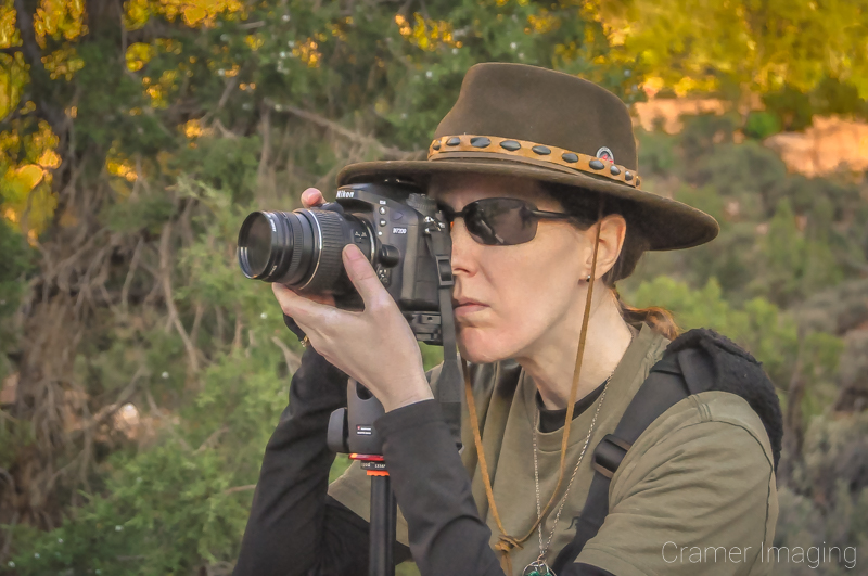 Landscape photographer Audrey Cramer with camera shooting a landscape scene