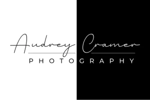 Two-tone Audrey Cramer Photography logo split between black and white