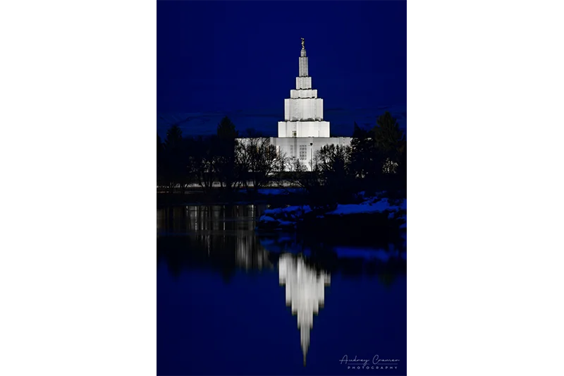 Audrey Cramer Photography's fine art photograph of the Idaho Falls LDS Temple at twilight in winter with Snake River reflection