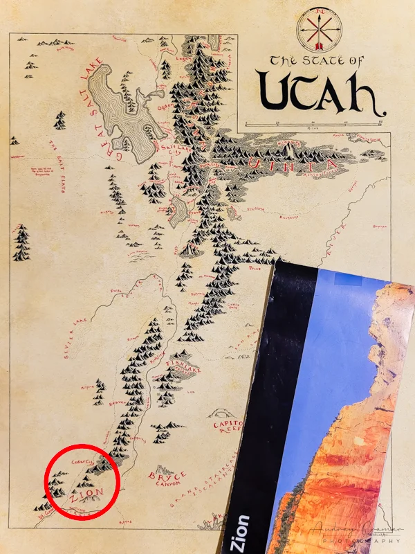 Photo of Utah state map with Zion National Park circled in red and official Zion map on top