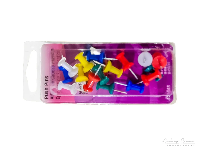 Audrey Cramer Photography's photo of a box of thumbtacks or push pins for hanging light stuff on walls