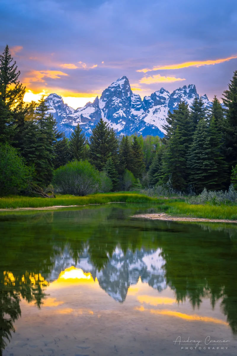 Audrey Cramer Photography's fine art landscape photograph of the mountains reflecting in a pond at sunset at Grand Teton National Park, Wyoming